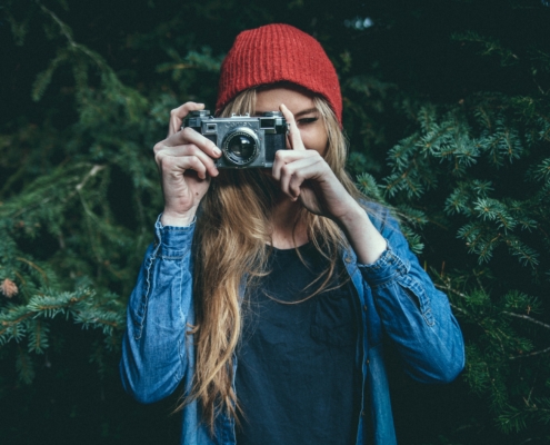 girl taking photo - micro-influencer